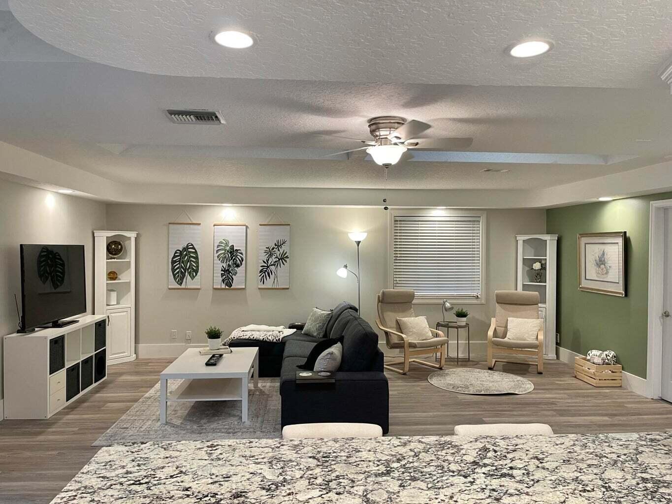 a very nice looking living room with a flat screen tv