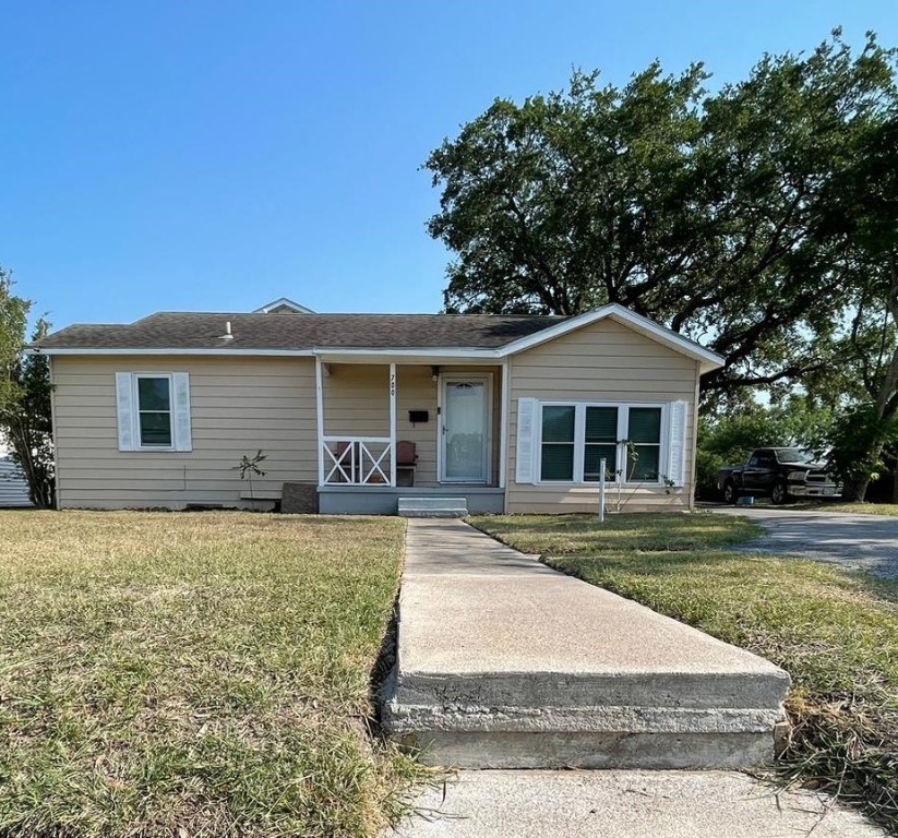 front view of a house with a yard