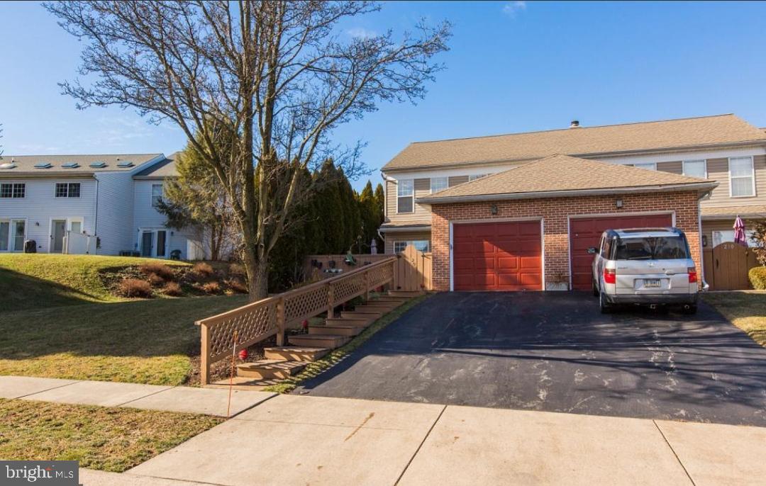 a view of a car park in front of house