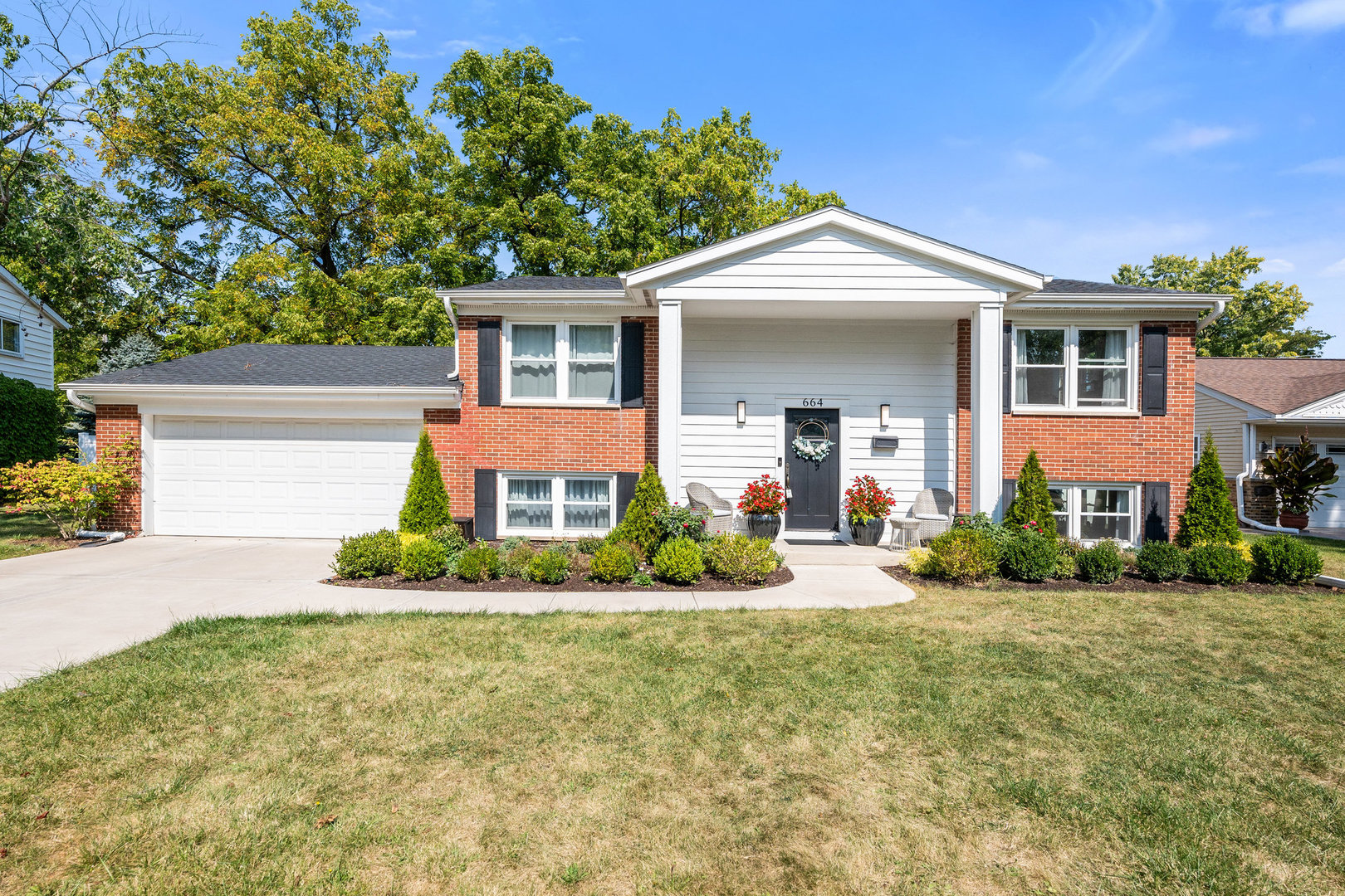 front view of a house with a yard