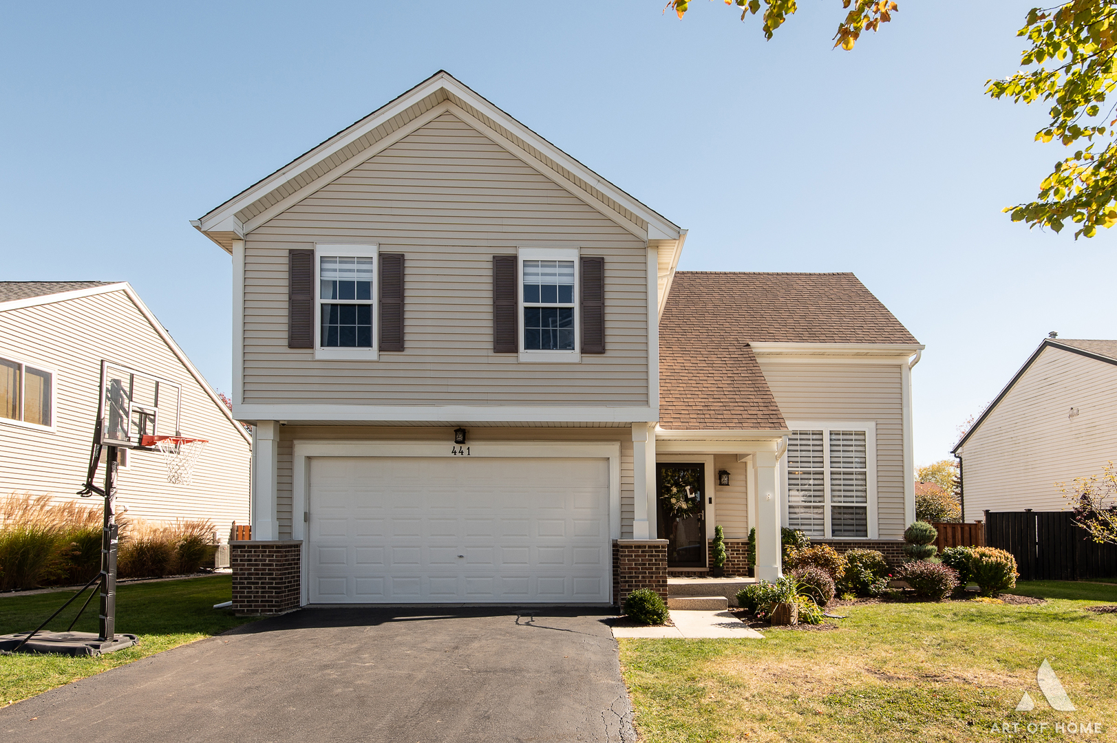 a front view of a house with a yard