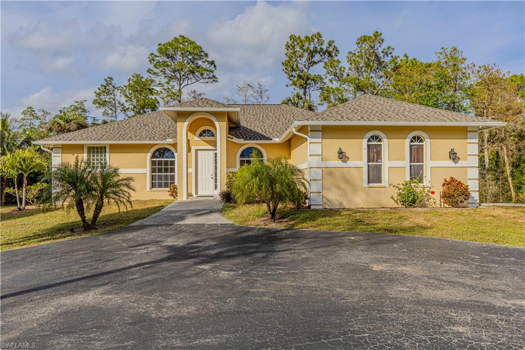 front view of a house with a yard