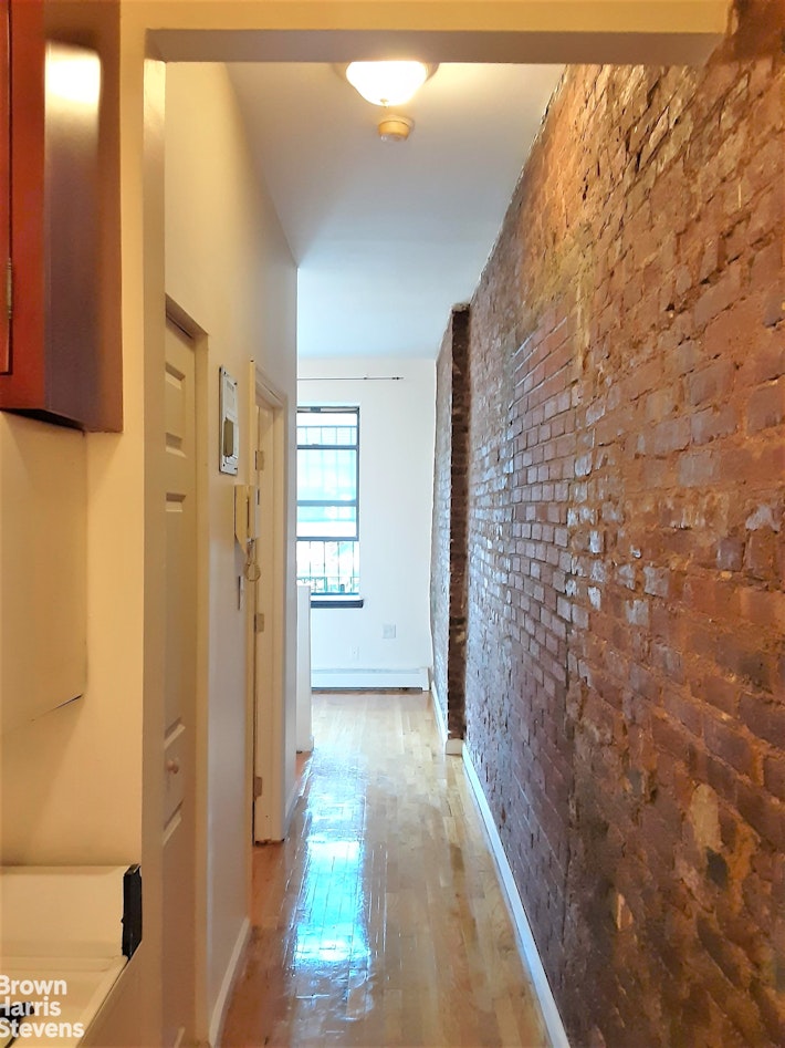 a bathroom with a shower and a door