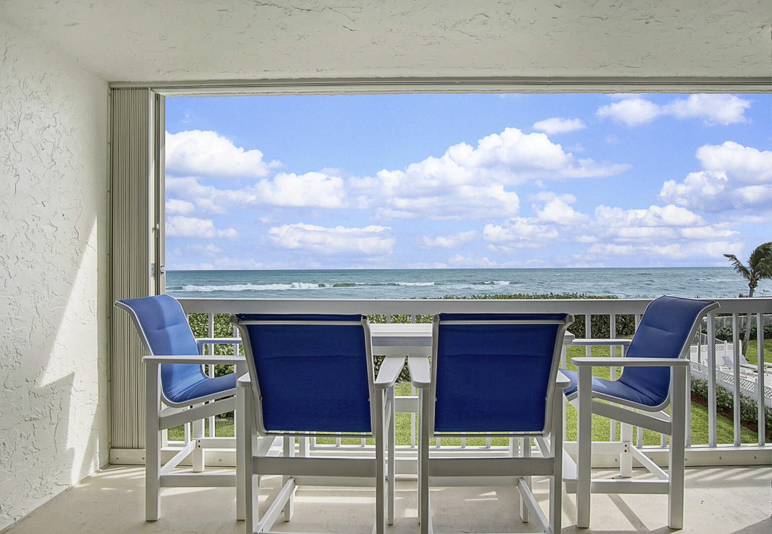 a view of a chairs and table in the terrace