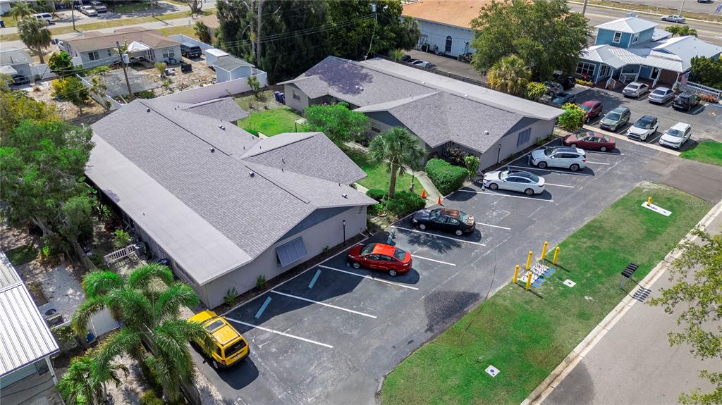 an aerial view of a house with a garden and swimming pool