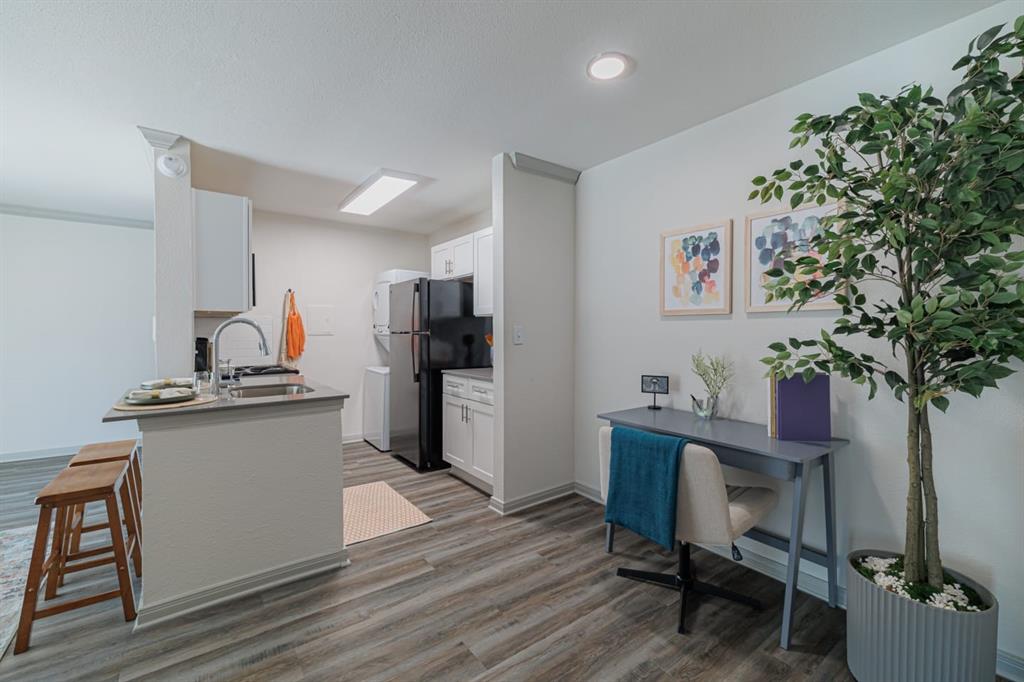 a kitchen with a table and chairs in it