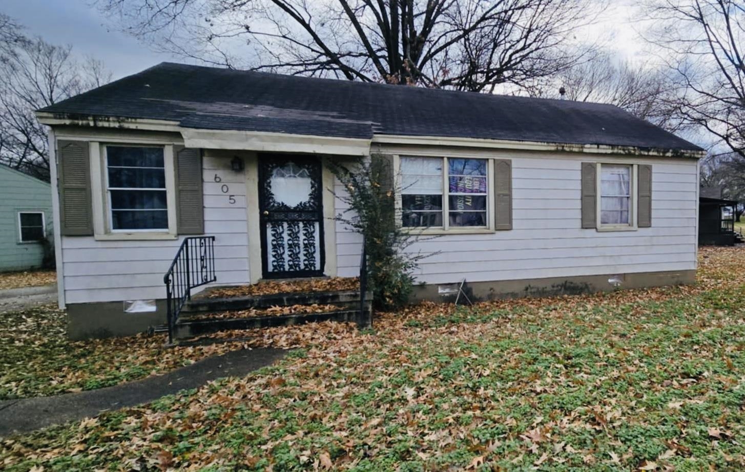 front view of a house with a yard