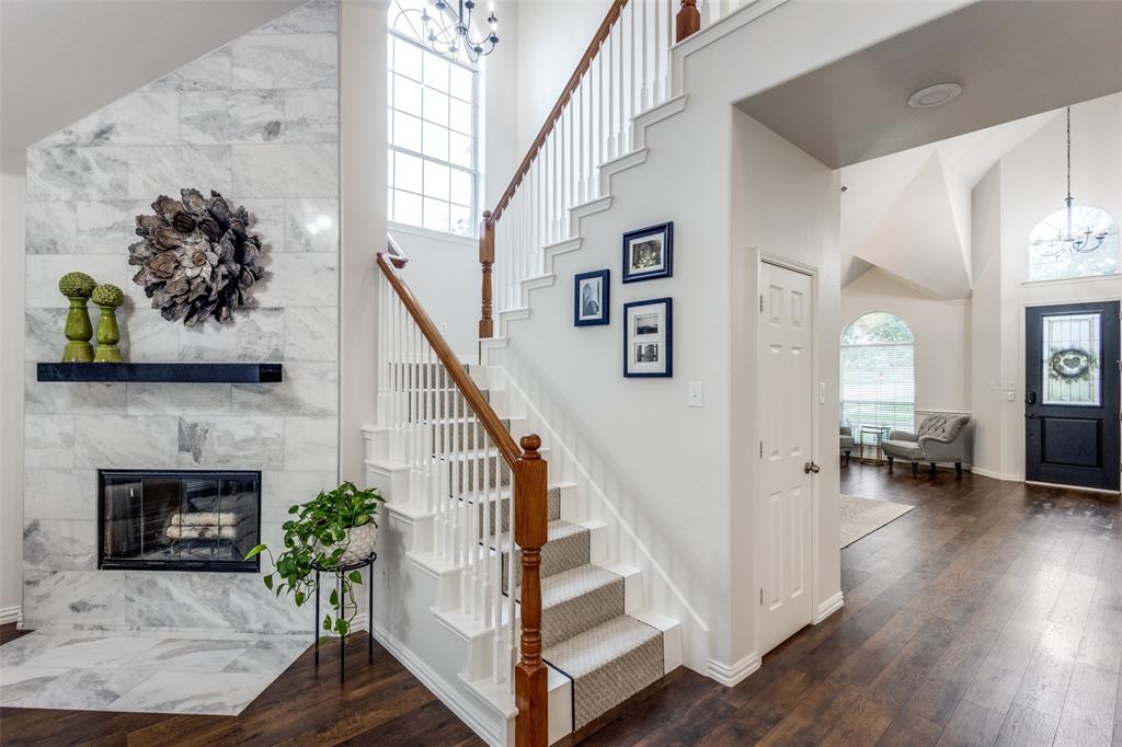 a view of entryway and hall with wooden floor