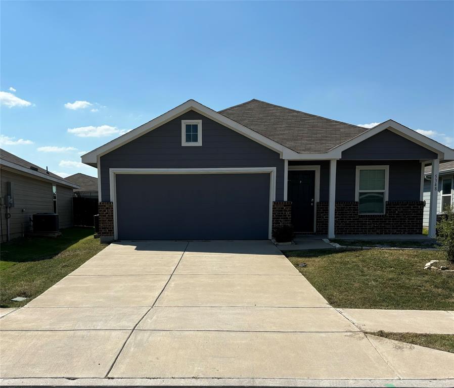 a front view of a house with yard