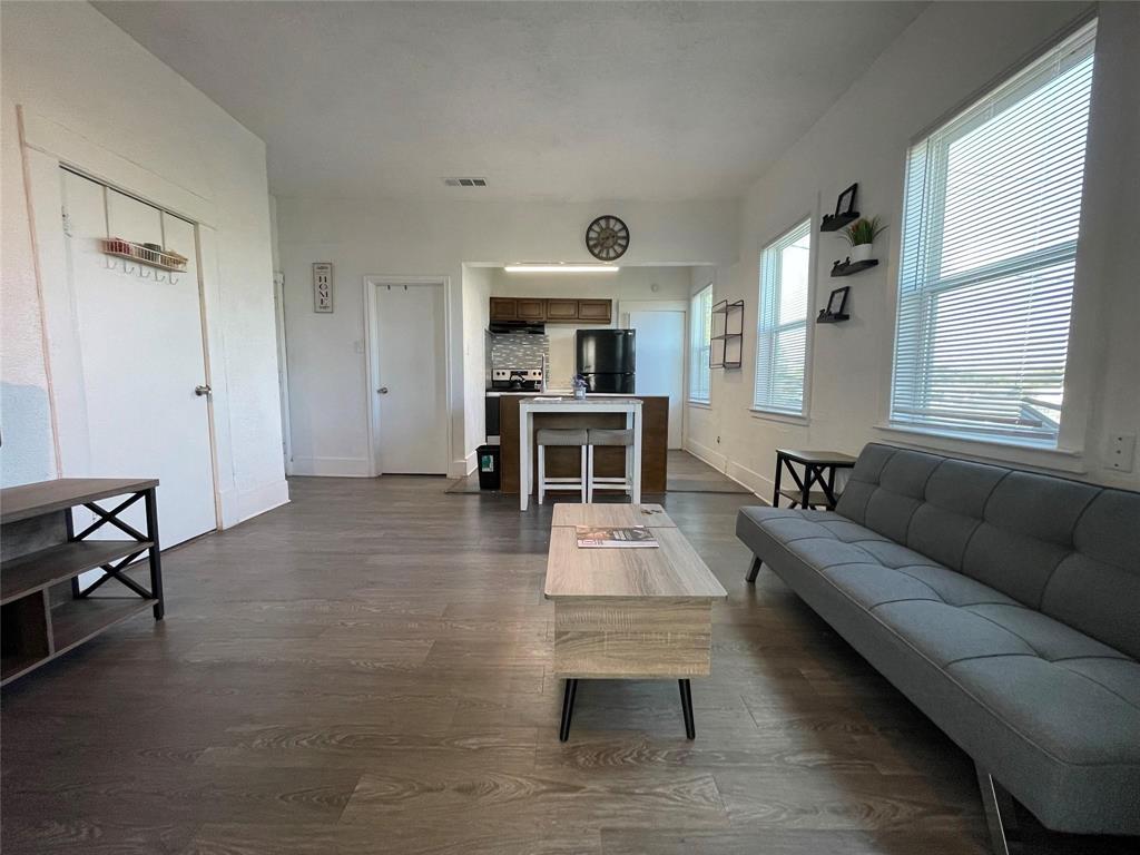 a living room with furniture and a table