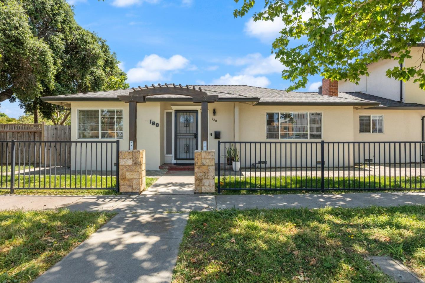 a view of a house with a fence