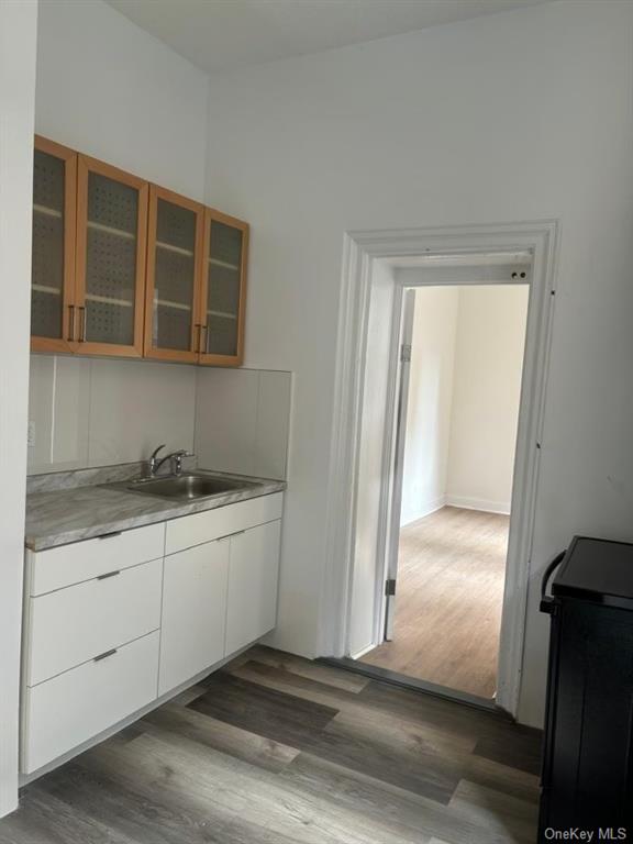 a view of a kitchen with a sink