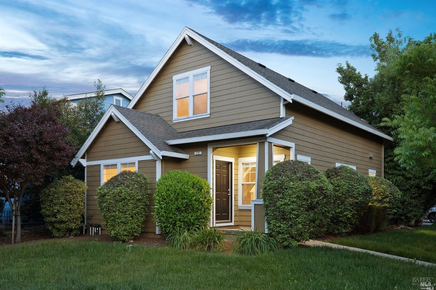 a front view of a house with a yard