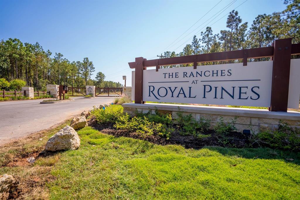 a view of sign board with green space