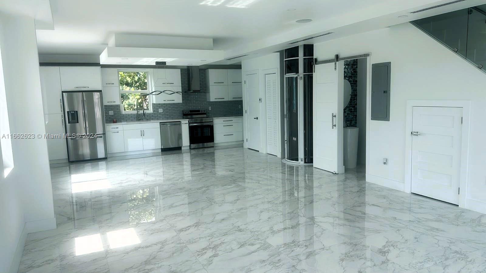 a kitchen with stainless steel appliances a refrigerator and cabinets