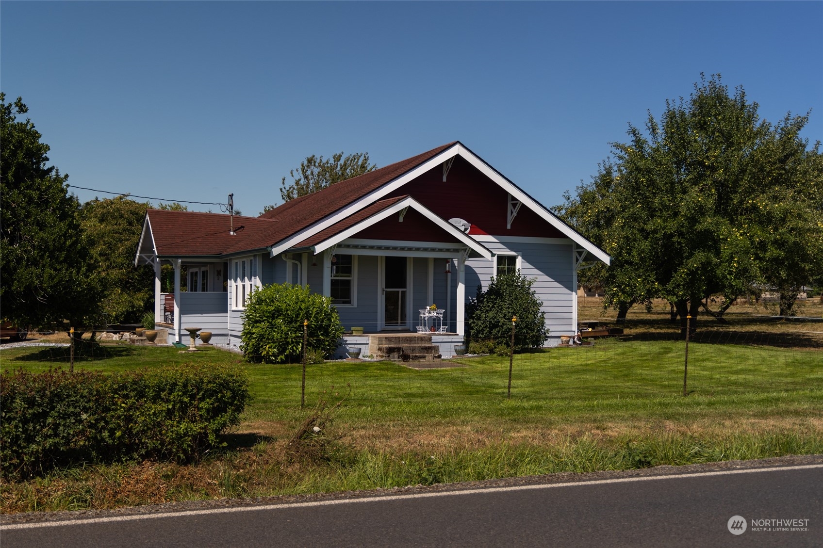 a front view of house with yard and green space