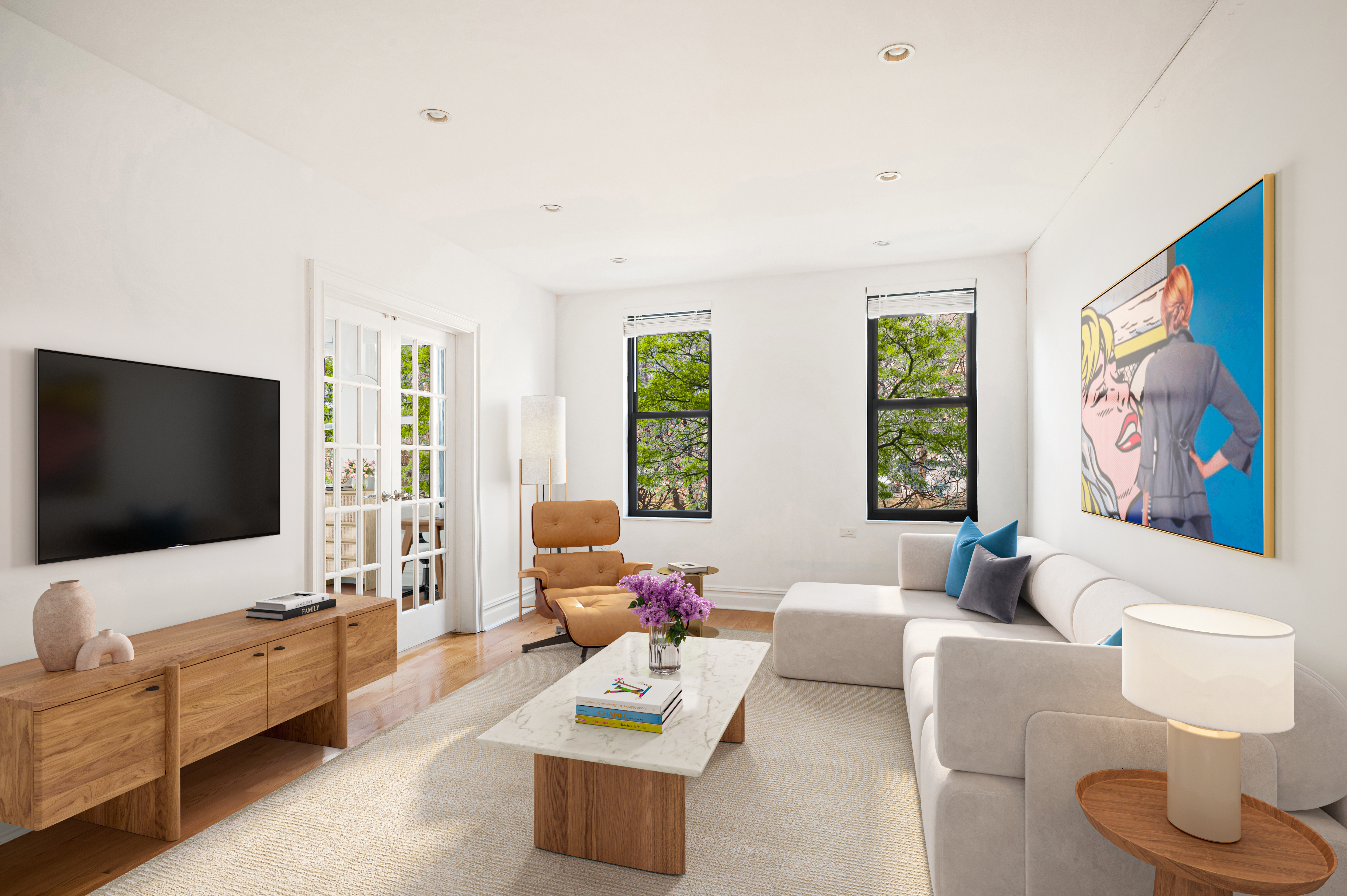 a living room with furniture and a flat screen tv