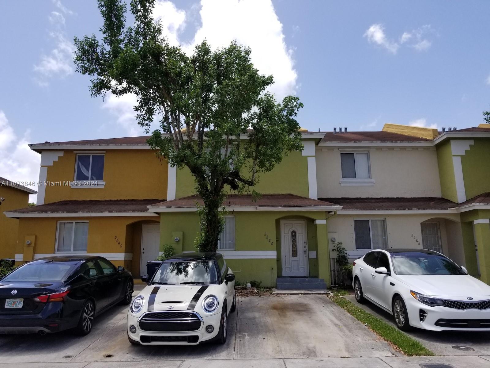 a car parked in front of a house