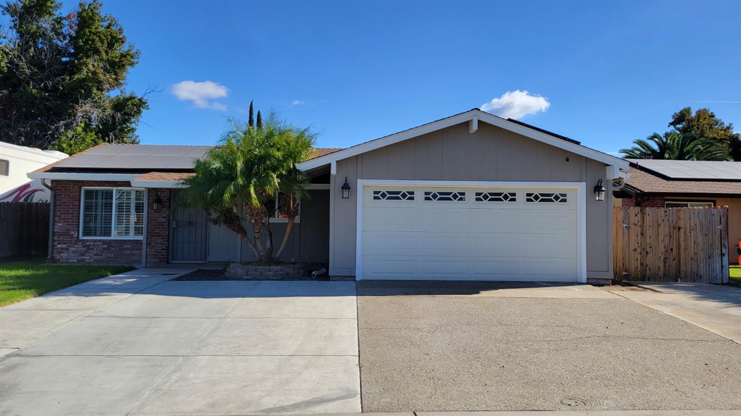 a front view of a house with a garage