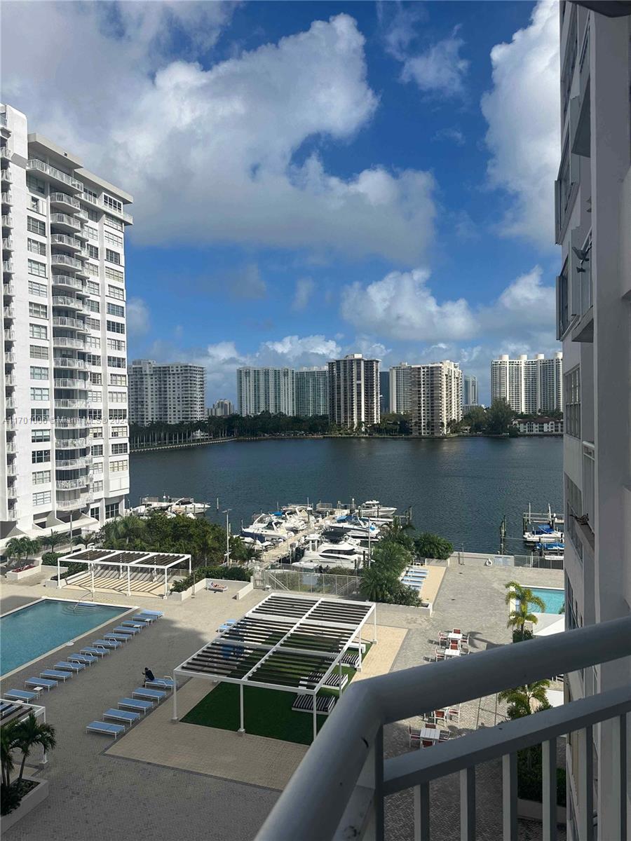 a view of a lake from a balcony with city view