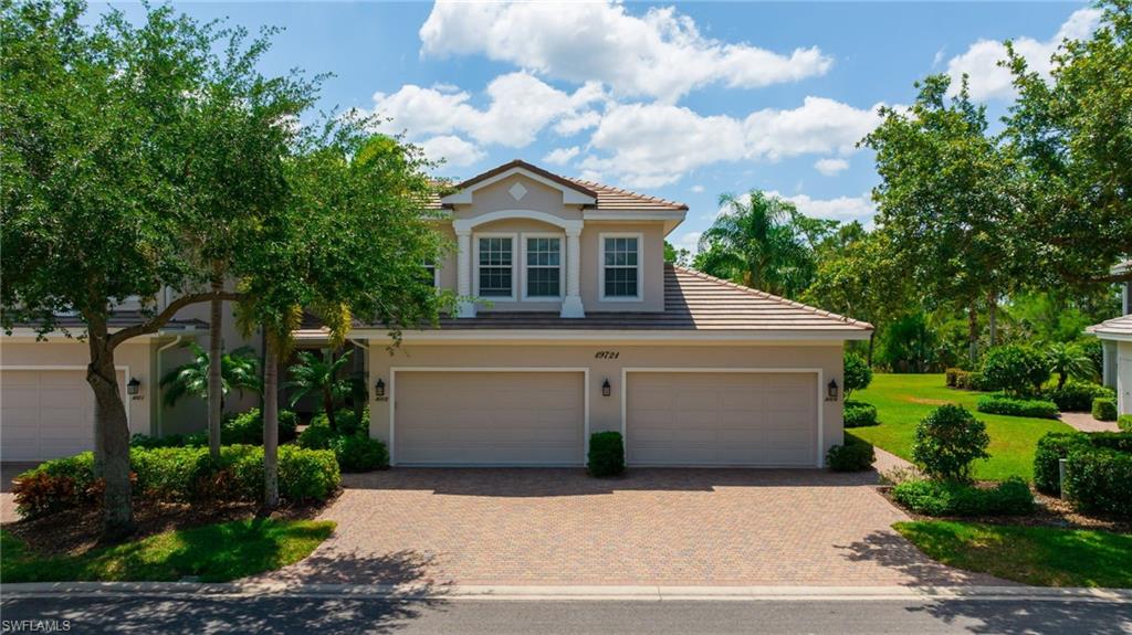 a front view of a house with a garage