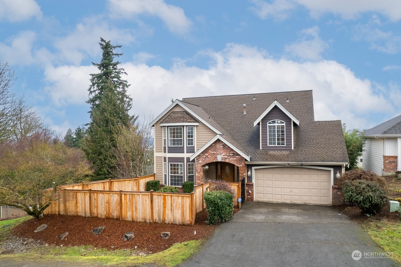 a front view of a house with yard