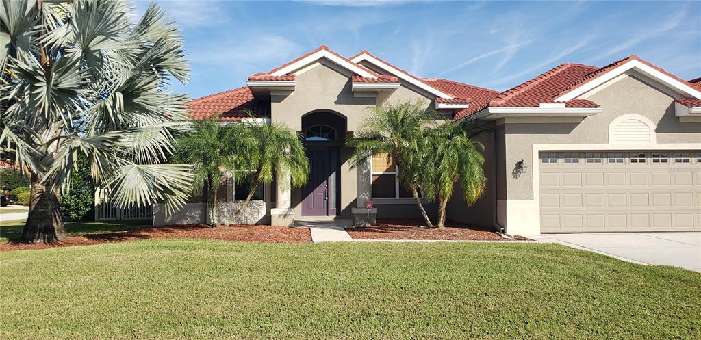 a front view of a house with a yard