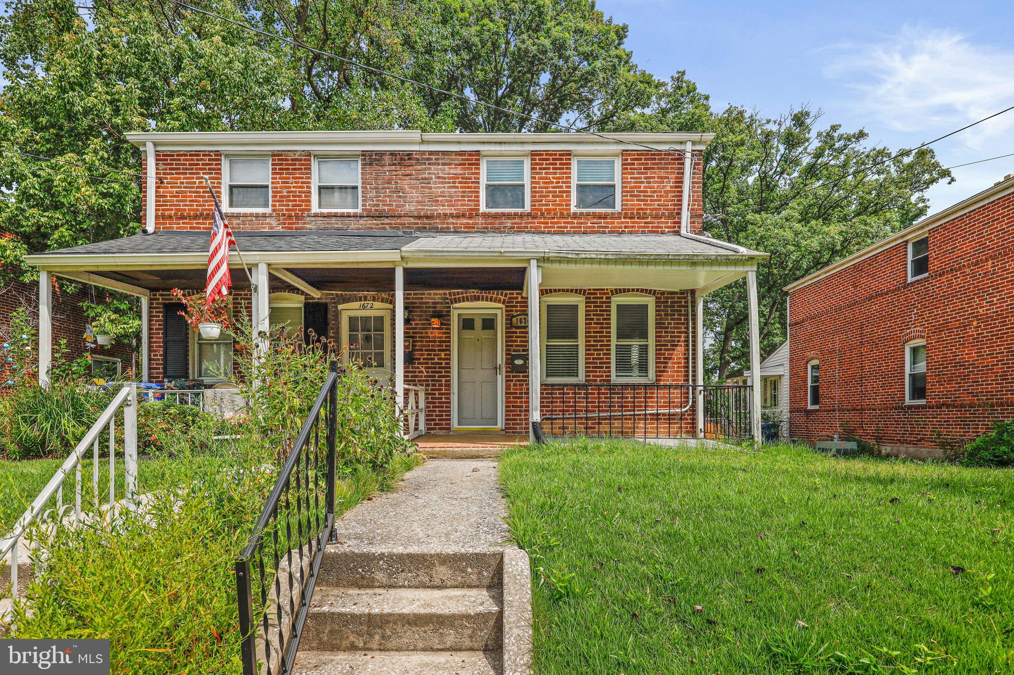 front view of a house with a yard