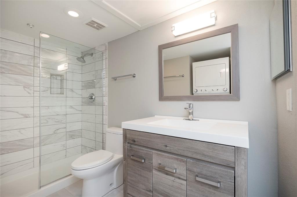 a bathroom with a sink toilet and mirror