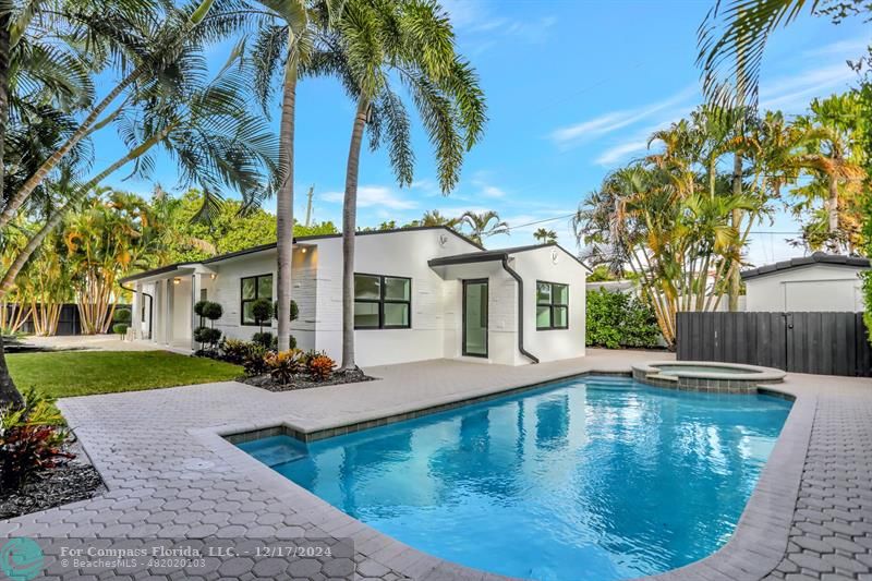 a view of a swimming pool with a patio