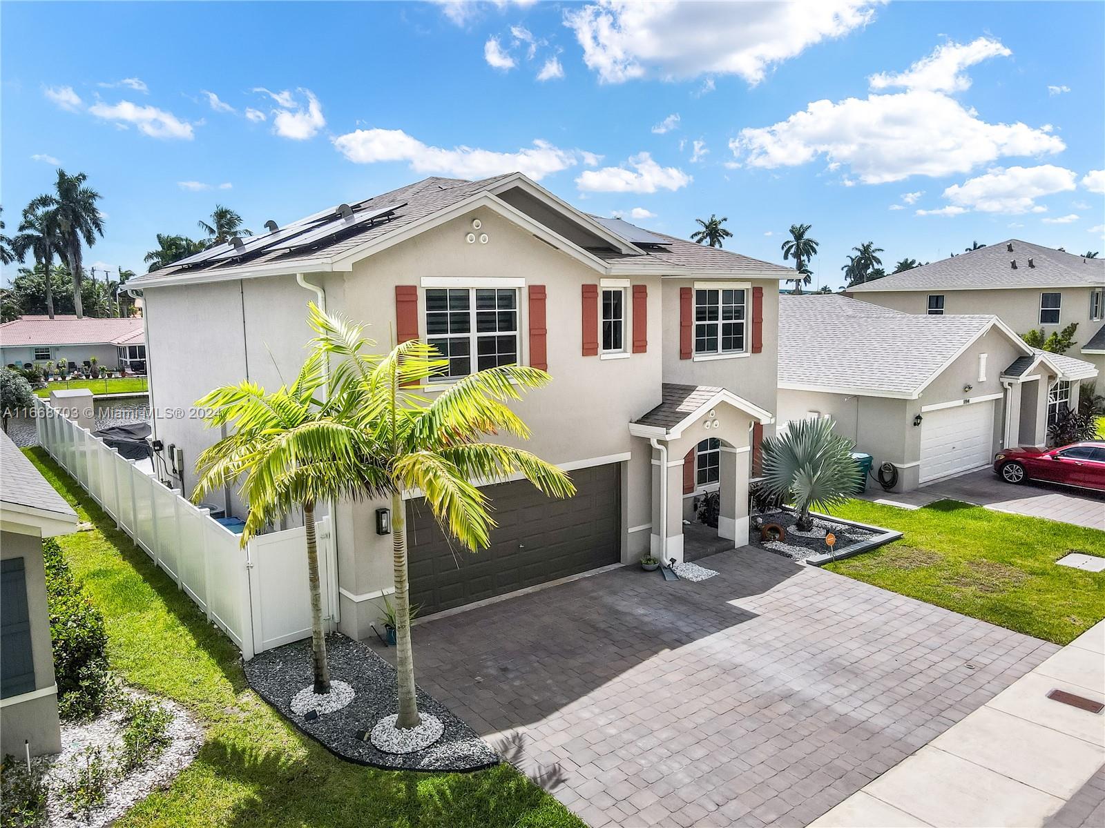 a front view of house with yard and entertaining space