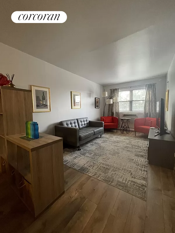 a living room with furniture window and a table