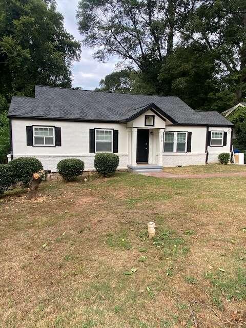 front view of a house with a yard