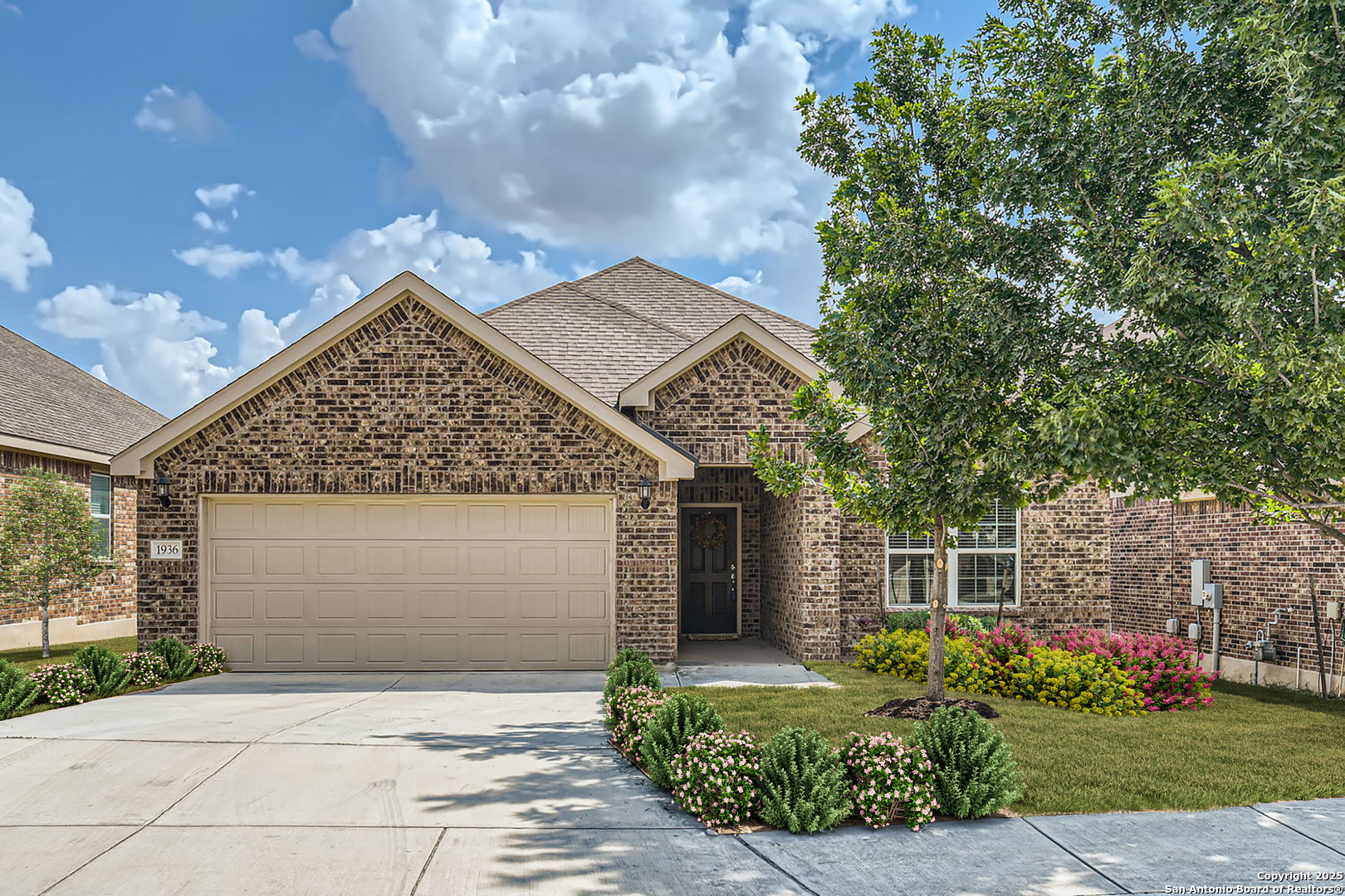 front view of a house with a yard