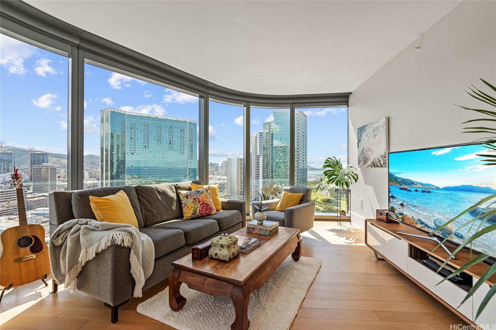 a living room with furniture and a flat screen tv