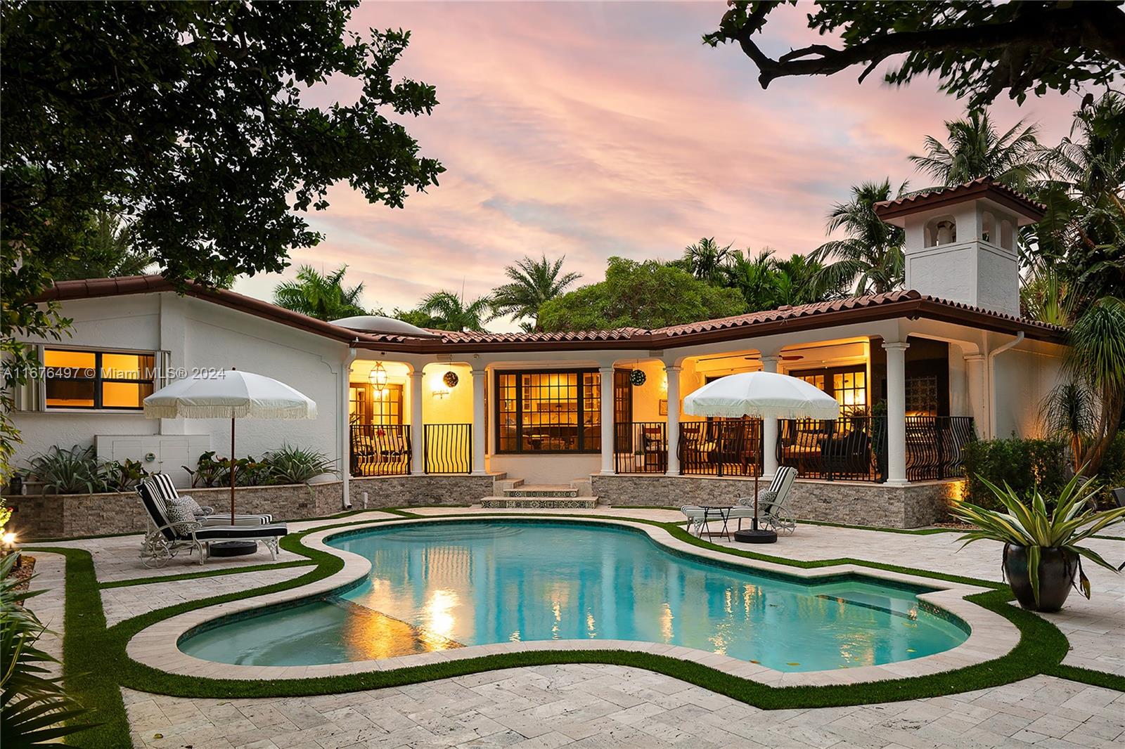 swimming pool view with a seating space and a garden view