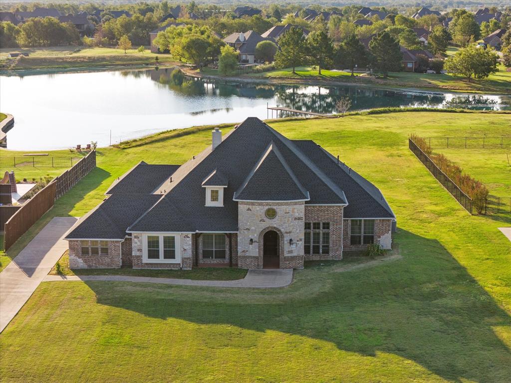 a aerial view of a house with swimming pool