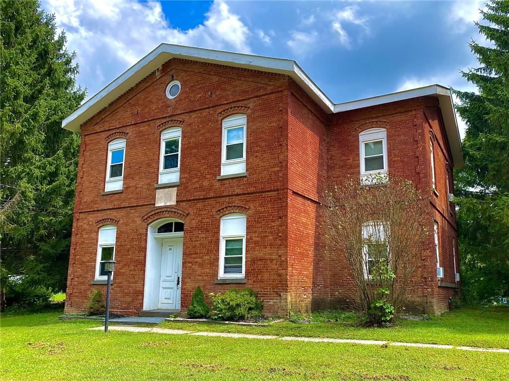 front view of a house with a yard