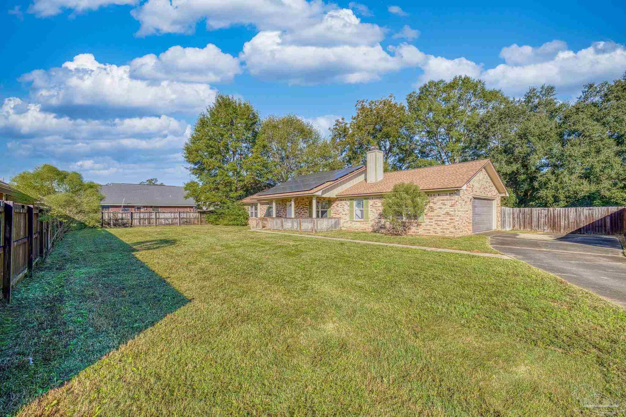 a view of a house with a yard