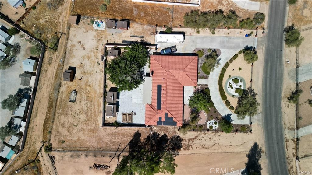 an aerial view of a house with a swimming pool