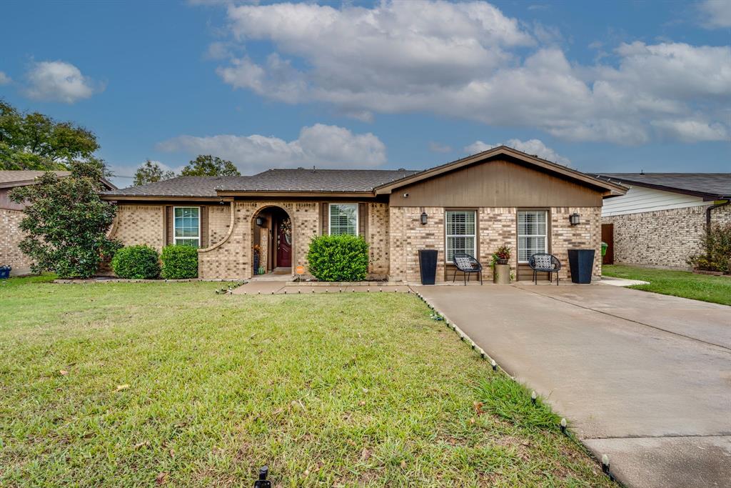 front view of a house with a yard