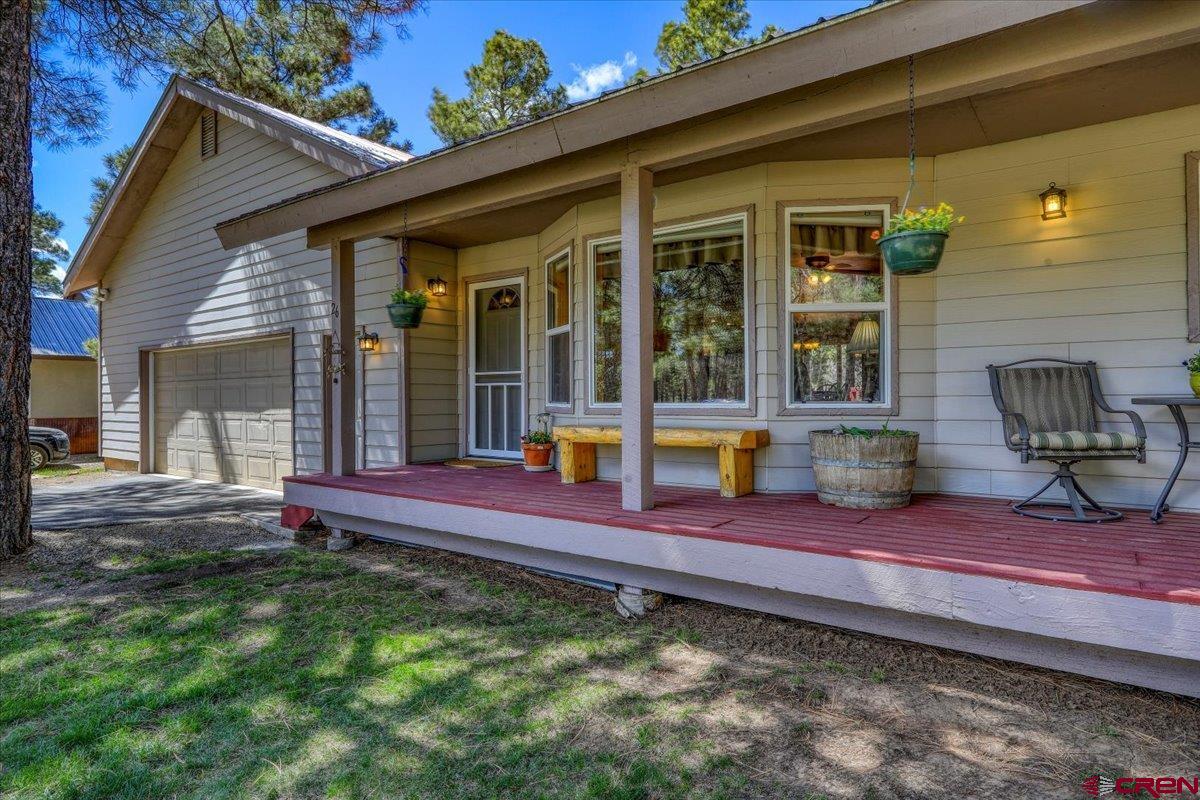 a view of a house with porch and sitting area