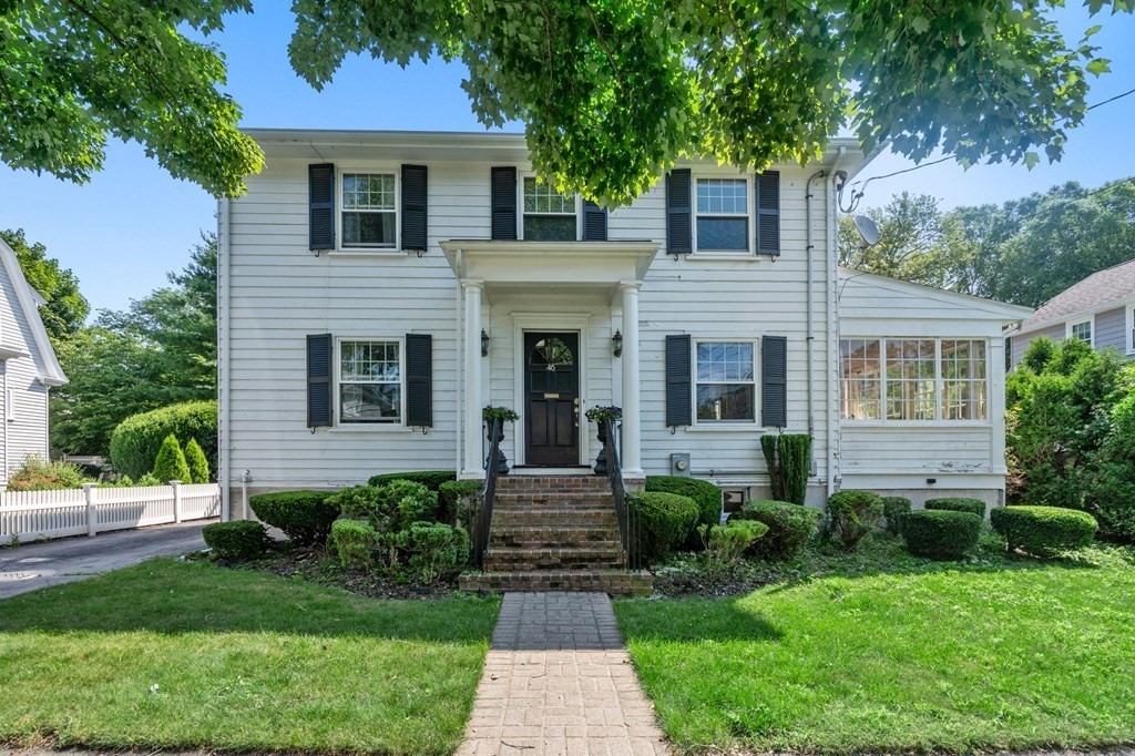 a front view of a house with garden