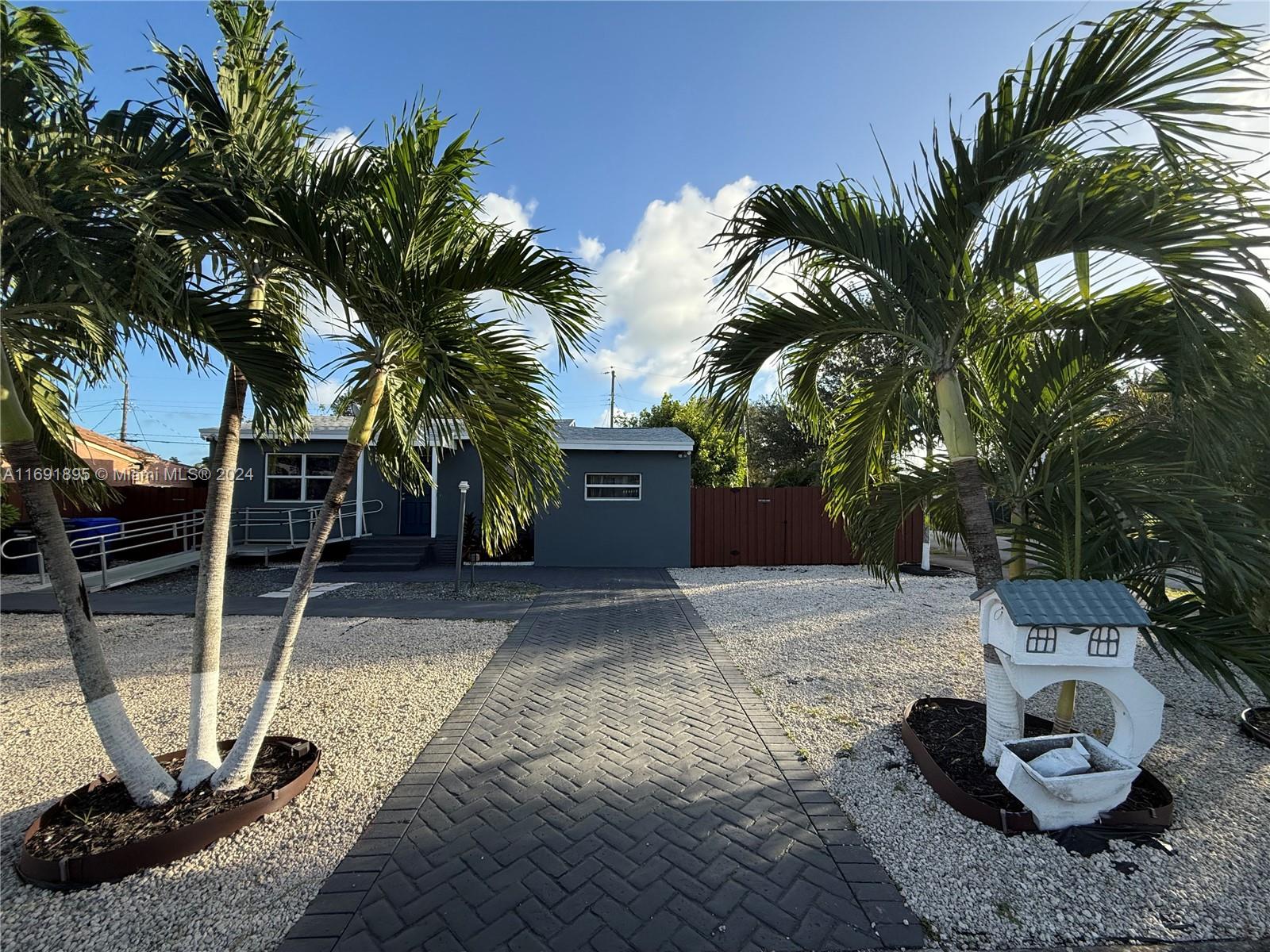 a view of a backyard with potted plants