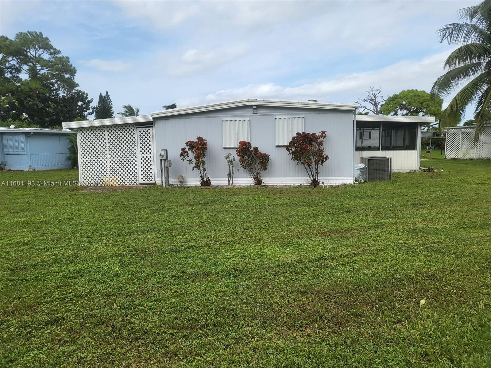 a view of a backyard with a garden and plants