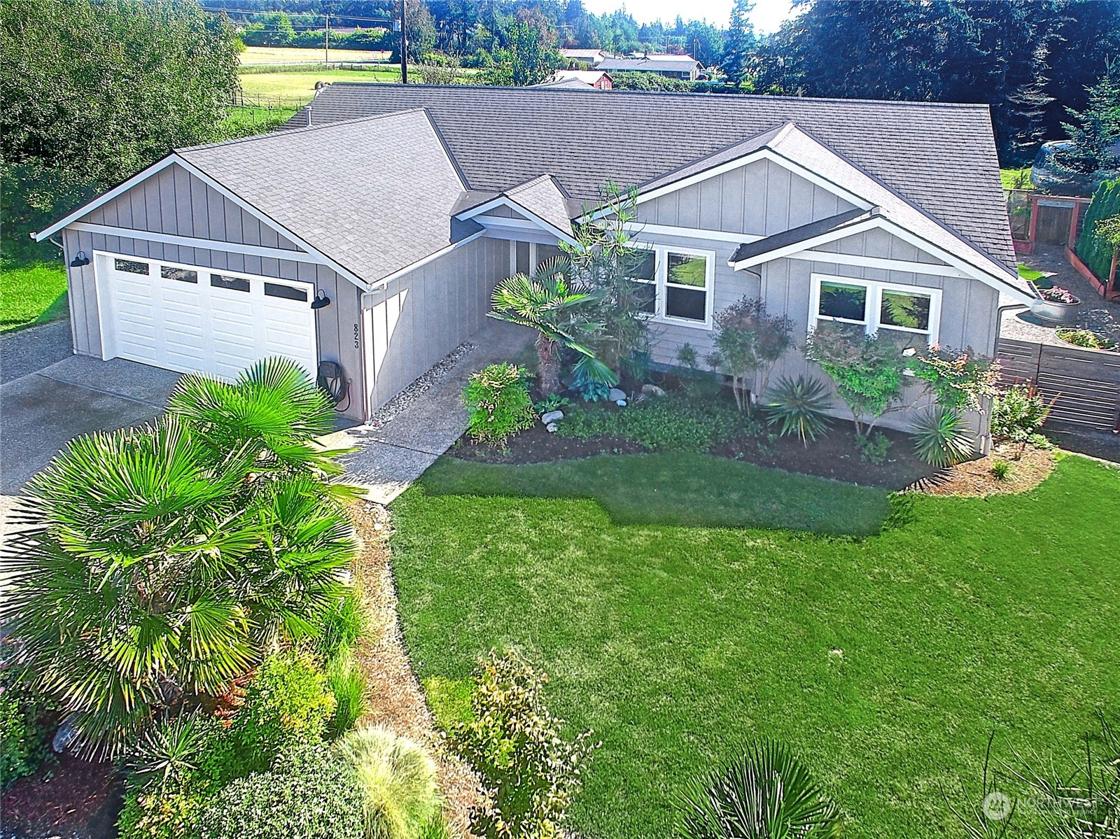 a aerial view of a house with a yard