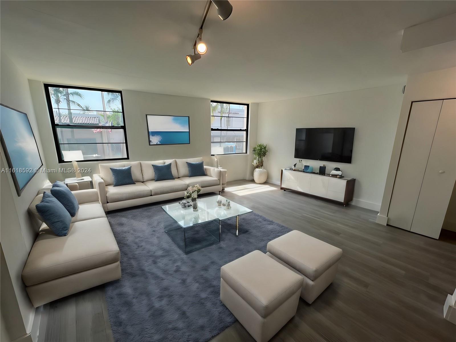 a living room with furniture and a flat screen tv