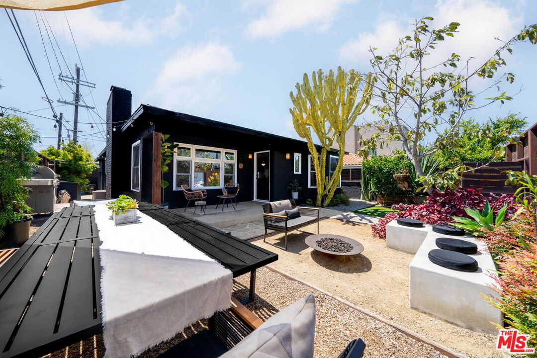 a view of a backyard with sitting area