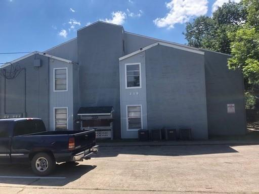 a car parked in front of a house