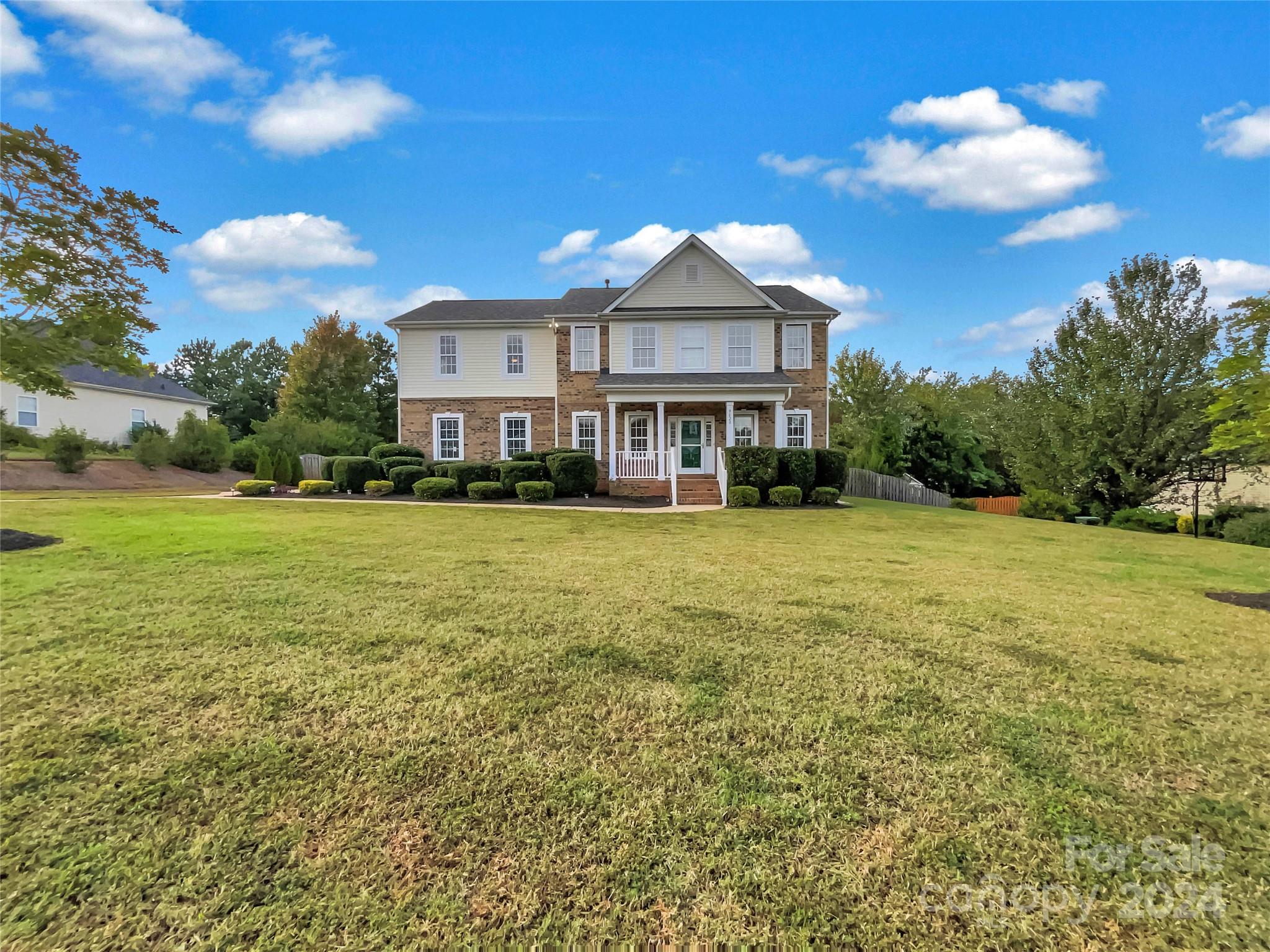 a view of a house with a big yard